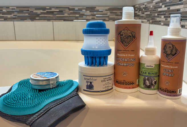 bath products sitting on side of bathtub
